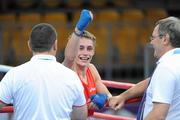 22 August 2010; Ryan Burnett, Ireland, celebrates his victory over Zohidjon Hoorboyev, Uzbekistan, following their Men's Light Fly 48Kg Semi-Final. Burnett won the bout 2-1 to advance to the final. 2010 Youth Olympic Games, Bisham Stadium, Singapore. Picture credit: James Veale / SPORTSFILE