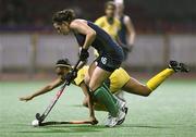 22 August 2010; Roisin Upton, Ireland, in action against Tiffany Jones, South Africa, during their preliminary girls' hockey match. Ireland won the game 1-0. 2010 Youth Olympic Games, Sengkang Hockey Stadium, Singapore.