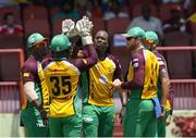 9 July 2016; Dwayne Smith (L), Anthony Bramble (2L), Steven Jacobs (2R) and Martin Guptill (R) of Guyana Amazon Warriors celebrate the dismissal of Evin Lewis of St Kitts & Nevis Patriots during Match 10 of the Hero Caribbean Premier League between Guyana Amazon Warriors and St Kitts & Nevis Patriots at Guyana National Stadium in Providence, Guyana. Photo by Randy Brooks/Sportsfile