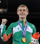 25 August 2010; Ireland's Ryan Burnett, Holy Family Boxing Club, Belfast, celebrates with his gold medal after the presentation in the Light Fly weight, 48kg, category. Burnett defeated Salman Alizida, of Azerbaijan, 13-6. 2010 Youth Olympic Games, International Convention Centre, Singapore.