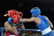 25 August 2010; Ireland's Ryan Burnett, Holy Family Boxing Club, Belfast, right, exchanges punches with Salman Alizida, Azerbaijan, during their Light Fly weight, 48kg, Final. Burnett defeated Salman Alizida, of Azerbaijan, 13-6. 2010 Youth Olympic Games, International Convention Centre, Singapore.