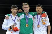 25 August 2010; Gold medalist, Ireland's Ryan Burnett, Holy Family Boxing Club, Belfast, centre, with Silver medalist Alizada Salman of Azerbaijan, and bronze medalist Hoorboyev Zohidjon of Uzbekistan, right, stand on the podium after the presentation in the Light Fly weight, 48kg, category. Burnett defeated Salman Alizida, of Azerbaijan, 13-6, in the Final. 2010 Youth Olympic Games, International Convention Centre, Singapore.
