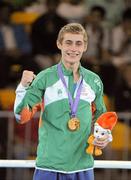 25 August 2010; Ireland's Ryan Burnett, Holy Family Boxing Club, Belfast, celebrates with his gold medal after the presentation in the Light Fly weight, 48kg, category. Burnett defeated Salman Alizida, of Azerbaijan, 13-6. 2010 Youth Olympic Games, International Convention Centre, Singapore. Picture credit: James Veale / SPORTSFILE