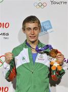 25 August 2010; Ireland's Ryan Burnett, Holy Family Boxing Club, Belfast, celebrates with his gold medal after the presentation in the Light Fly weight, 48kg, category. Burnett defeated Salman Alizida, of Azerbaijan, 13-6. 2010 Youth Olympic Games, International Convention Centre, Singapore. Picture credit: James Veale / SPORTSFILE