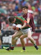 10 July 2016; John Cunnane of Mayo is tackled by Robert Finnerty of Galway during the Electric Ireland Connacht GAA Football Minor Championship Final between Galway and Mayo at Pearse Stadium in Galway. Photo by Ramsey Cardy/Sportsfile