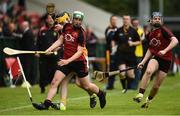 10 July 2016; Diarmuid McShane of Antrim in action against Adrian Mee and Donal Og Rooney, right, of Down during the Electric Ireland Ulster GAA Hurling Minor Championship Final match between Antrim and Down at Derry GAA Centre of Excellence in Owenbeg, Derry. Photo by Oliver McVeigh/Sportsfile