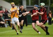 10 July 2016; Diarmuid McShane of Antrim in action against Adrian Mee, right, and Donal Og Rooney of Down during the Electric Ireland Ulster GAA Hurling Minor Championship Final match between Antrim and Down at Derry GAA Centre of Excellence in Owenbeg, Derry. Photo by Oliver McVeigh/Sportsfile