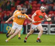 10 July 16;  Eoin McGuinness of Armagh in action against Neal McAuley of Antrim during the Ulster GAA Hurling Senior Championship Final match between Antrim and Armagh at Derry GAA Centre of Excellence in Owenbeg, Derry. Photo by Philip Fitzpatrick/SPORTSFILE.