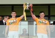 10 July 2016; Conor Carson, left, and Alex O'Boyle of Antrim hold aloft the Danny McNauhton cup after the Electric Ireland Ulster GAA Hurling Minor Championship Final match between Antrim and Down at Derry GAA Centre of Excellence in Owenbeg, Derry. Photo by Oliver McVeigh/Sportsfile