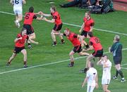 29 August 2010; Down players, including Damien Rafferty, Kevin McKernan, 6, Conor Maginn, 25, Benny Coulter, 13, Peter Fitzpatrick, 8, and James Colgan, 18, celebrate as referee Pat McEnaney blows the final whistle as dejected Kildare players react. GAA Football All-Ireland Senior Championship Semi-Final, Kildare v Down, Croke Park, Dublin. Picture credit: Brendan Moran / SPORTSFILE