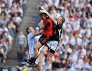 29 August 2010; Brendan Coulter, centre, Down, fists the ball past Emmet Bolton, left, Kildare and Shane McCormack, to score his side's first goal. GAA Football All-Ireland Senior Championship Semi-Final, Kildare v Down, Croke Park, Dublin. Picture credit: Barry Cregg / SPORTSFILE