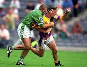 29 July 2001; Rory McCarthy of Wexford is tackled by Clement Smith of Limerick during the Guinness All-Ireland Senior Hurling Championship Quarter-Final match between Wexford and Limerick at Croke Park in Dublin. Photo by Damien Eagers/Sportsfile
