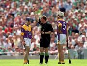 29 July 2001; Liam Dunne of Wexford is shown the yellow card by referee Michael Wadding during the Guinness All-Ireland Senior Hurling Championship Quarter-Final match between Wexford and Limerick at Croke Park in Dublin. Photo by Damien Eagers/Sportsfile