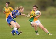 4 September 2010; Geraldine McLaughlin, Donegal, in action against Mairead Moore, Longford. TG4 Ladies Football All-Ireland Intermediate Championship Semi-Final, Longford v Donegal, Ballymahon, Longford. Picture credit: Oliver McVeigh / SPORTSFILE