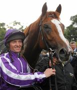 4 September 2010; Jockey Seamus Heffernan with his mount Cape Blanco after winning the Tattersalls Millions Irish Champion Stakes. Leopardstown Racecourse, Dublin. Picture credit: Brendan Moran / SPORTSFILE