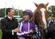 4 September 2010; Trainer Aidan O'Brien and jockey Seamus Heffernan with Cape Blanco after winning the Tattersalls Millions Irish Champion Stakes aboard Cape Blanco. Leopardstown Racecourse, Dublin. Picture credit: Brendan Moran / SPORTSFILE