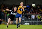 16 July 2016; Pearse Lillis of Clare in action against Eoin Flanagan of Sligo during the GAA Football All-Ireland Senior Championship Round 3A match between Sligo and Clare at Markievicz Park in Sligo.  Photo by Oliver McVeigh/Sportsfile