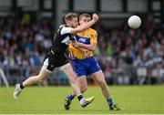 16 July 2016; Keelan Cawley of Sligo in action against Sean Collins of Clare during the GAA Football All-Ireland Senior Championship Round 3A match between Sligo and Clare at Markievicz Park in Sligo.  Photo by Oliver McVeigh/Sportsfile