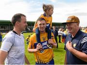 16 July 2016; David Turbidy and Enda Coughlin and daughter Abbey of Clare celebrate with supporters after the GAA Football All-Ireland Senior Championship Round 3A match between Sligo and Clare at Markievicz Park in Sligo.  Photo by Oliver McVeigh/Sportsfile
