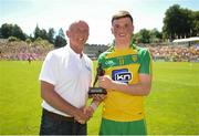 17 July 2016; Pictured is Vincent Litchfield, Customer Relationship Manager of Electric Ireland, proud sponsor of the GAA All-Ireland Minor Championships, presenting Niall O'Donnell from Donegal with the Player of the Match award for his outstanding performance in the Electric Ireland Ulster Minor Football Championship Final. Throughout the Championship fans can follow the conversation, support the Minors and be a part of something major through the hashtag #GAAThisIsMajor. St Tiernach's Park in Clones, Co Monaghan. Photo by Ramsey Cardy/Sportsfile