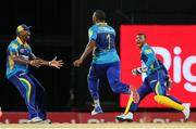 17 July 2016; Tridents players (L) Navin Stewart, Raymon Riefer (C) and Nicholas Pooran (R) celebrate the wicket of Darren Sammy during Match 18 of the Hero Caribbean Premier League match between Barbados Tridents v St Lucia Zouks at Kensington Oval in Bridgetown, Barbados. Photo by Ashley Allen/Sportsfile