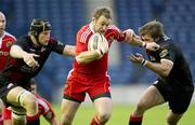 10 September 2010; Johne Murphy, Munster, in action against Scott Newlands, left, and Alex Grove, Edinburgh. Celtic League, Edinburgh v Munster, Murrayfield, Edinburgh, Scotland. Picture credit: Bill Murray / SPORTSFILE