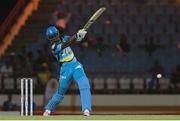 21 July 2016; Darren Sammy smashes a four during Match 21 of the Hero Caribbean Premier League match between the St Lucia Zouks and the Nevis Patriots at the Daren Sammy Cricket Stadium, Gros Islet, St Lucia.  Photo by Ashley Allen/Sportsfile