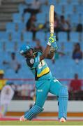 21 July 2016; Zouks batsman Johnson Charles hits 6 during Match 21 of the Hero Caribbean Premier League match between the St Lucia Zouks and the Nevis Patriots at the Daren Sammy Cricket Stadium, Gros Islet, St Lucia.  Photo by Ashley Allen/Sportsfile