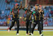 21 July 2016; Patriots players (from left) Sheldon Cottrell, Jonathan Carter, Faf du Plessis and JJ Smutts celebrate the wicket of Shane Watson during Match 21 of the Hero Caribbean Premier League match between the St Lucia Zouks and the Nevis Patriots at the Daren Sammy Cricket Stadium, Gros Islet, St Lucia.  Photo by Ashley Allen/Sportsfile
