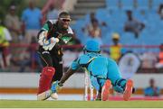 21 July 2016; Zouks batsman Johnson Charles (R) dives back to make his ground as Patriots wicket keeper Devon Thomas (L) gathers the ball during Match 21 of the Hero Caribbean Premier League match between the St Lucia Zouks and the Nevis Patriots at the Daren Sammy Cricket Stadium, Gros Islet, St Lucia.  Photo by Ashley Allen/Sportsfile