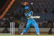 21 July 2016; Zouks captain Daren Sammy hits six during Match 21 of the Hero Caribbean Premier League match between the St Lucia Zouks and the Nevis Patriots at the Daren Sammy Cricket Stadium, Gros Islet, St Lucia.  Photo by Ashley Allen/Sportsfile