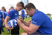 27 July 2016; Leinster's Cian Healy signs an autograph for Bobby Flanahan, age 8, from Kildare Town, during the Bank of Ireland Leinster Rugby Summer Camp at Cill Dara RFC in Dunmurray West, Kildare. Photo by Piaras Ó Mídheach/Sportsfile