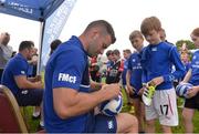 27 July 2016; Leinster's Fergus McFadden signs an autograph for George Wells, age 9, from Newbridge, during the Bank of Ireland Leinster Rugby Summer Camp at Cill Dara RFC in Dunmurray West, Kildare. Photo by Piaras Ó Mídheach/Sportsfile