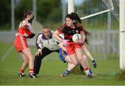 27 July 2016; Leoni McIlroy of Derry makes a save on the line despite the attention of Niam Brady of Longford during the All Ireland Ladies Football U16 ‘C’ Championship Final 2016 match between Derry and Longford at Fr. Hackett Park in Augher, Co Tyrone. Photo by Oliver McVeigh/Sportsfile