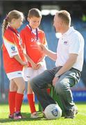 27 September 2010; 300 children from all over the country realised their dreams today when they got to play a match in the world-famous Croke Park stadium as part of the 2010 Vhi Cúl Day Out. The Vhi Cúl Day Out is a nationwide competition which was open to all 80,000 children who attended one of the 1000 Vhi GAA Cúl Camps held over the course of the summer. Today’s lucky 300 winners got to train and play a match in the world-famous stadium. GAA heroes such as Bernard Brogan, Anthony Daly and Eoin Kelly as well as other hurling, football, camogie and handball stars around the country were there to work with the children on the day to help them develop their skills and reinforce their passion for the game. Pictured are Megan Collins, age 10, from Baltimore, Co. Cork and Oisin Mulvaney, age 10, from Killygary, Co. Cavan with Declan Moran, Director of Marketing and Business Development, VHI Healthcare. Vhi GAA Cúl Day Out 2010, Croke Park, Dublin. Picture credit: Brendan Moran / SPORTSFILE