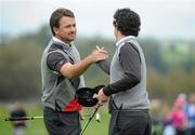 28 September 2010; Graeme McDowell and Rory Mcllroy, Team Europe, on the 10th green after winning their practice round against Francesco and Edoardo Molinati. 2010 Ryder Cup - Practice Day, The Celtic Manor Resort, City of Newport, Wales. Picture credit: Matt Browne / SPORTSFILE