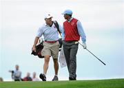 28 September 2010; Tiger Woods, Team USA, with his caddie Steve Williams on the 18th fairway. 2010 Ryder Cup - Practice Day, The Celtic Manor Resort, City of Newport, Wales. Picture credit: Matt Browne / SPORTSFILE