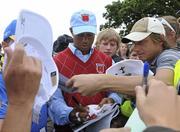 28 September 2010; Tiger Woods, Team USA, signs autographs on his way from the 18th green back to the club house. 2010 Ryder Cup - Practice Day, The Celtic Manor Resort, City of Newport, Wales. Picture credit: Matt Browne / SPORTSFILE