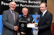 30 September 2010; Presenting Eddie O'Neill of Drimnagh Celtic F.C., Drimnagh, Dublin, with his award at the 2010 Texaco Sportstars Bursaries Awards Presentation are Eddie Keher, left, and Enda Riney, right, Country Chairman of Chevron Ireland. Conrad Hotel, Earlsfort Terrace, Dublin. Picture credit: Barry Cregg / SPORTSFILE