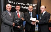 30 September 2010; Presenting Colm Gildea and David Flood of Kinnegad Juniors AFC, Kinnegad, Co. Westmeath, with their award at the 2010 Texaco Sportstars Bursaries Awards Presentation are Eddie Keher, left, and Enda Riney, right, Country Chairman of Chevron Ireland. Conrad Hotel, Earlsfort Terrace, Dublin. Picture credit: Barry Cregg / SPORTSFILE