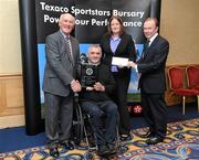 30 September 2010; Presenting Garrett Culliton and Orla Dempsey of Clonaslee Wheelchair Basketball Club, Co. Laois, with their award at the 2010 Texaco Sportstars Bursaries Awards Presentation are Eddie Keher, left, and Enda Riney, right, Country Chairman of Chevron Ireland. Conrad Hotel, Earlsfort Terrace, Dublin. Picture credit: Barry Cregg / SPORTSFILE