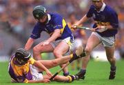 12 August 2001; Rory McCarthy of Wexford in action against David Kennedy of Tipperary during the Guinness All-Ireland Senior Hurling Championship Semi-Final match between Wexford and Tipperary at Croke Park in Dublin. Photo by Ray McManus/Sportsfile