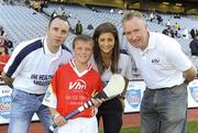 27 September 2010; Ciaran Doyle, from Offaly, with Tipperary hurler Eoin Kelly, Wexford camogie player Mags D'Arcy, and Declan Moran, Director of Marketing and Business Development Vhi. Vhi GAA Cúl Day Out 2010, Croke Park, Dublin. Picture credit: Oliver McVeigh / SPORTSFILE