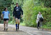 4 October 2010; A cyclist rides by as Leinster's Isaac Boss, left, and Devin Toner arrive for squad training ahead of their Heineken Cup, Pool 2, Round 1, match against Racing-Metro 92, on Saturday. Leinster rugby squad training, UCD, Belfield, Dublin. Picture credit: Stephen McCarthy / SPORTSFILE