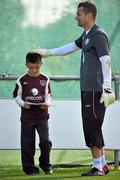 5 October 2010; Republic of Ireland goalkeeper Shay Given after signing an autograph for Cillian Prunty, age 8, from Raheny, Dublin, during squad training ahead of their EURO 2012 Championship Group B Qualifier against Russia on Friday. Republic of Ireland Squad Training, Gannon Park, Malahide, Co. Dublin. Picture credit: David Maher / SPORTSFILE