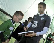 5 October 2010; Scott Conway, age 6, a patient from Tallaght Children's Hospital, is pictured with Republic of Ireland captain Robbie Keane after squad training ahead of their Euro 2012 Championship Group B Qualifier against Russia on Friday. Republic of Ireland Media Update, Gannon Park, Malahide , Co. Dublin. Picture credit: David Maher / SPORTSFILE