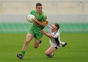 10 October 2010; Declan Murphy, Rhode, in action against Lorcan Hiney, Clara. Offaly County Senior Football Championship Final, Rhode v Clara, O'Connor Park, Tullamore, Co. Offaly. Photo by Sportsfile