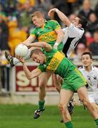 10 October 2010; Shane Sullivan, left, and Brian Darby, Rhode in action against Thomas Deehan, Clara. Offaly County Senior Football Championship Final, Rhode v Clara, O'Connor Park, Tullamore, Co. Offaly. Photo by Sportsfile