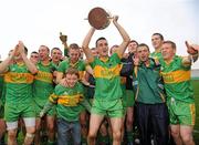 10 October 2010; Rhode players celebrate with the Dowling Cup after the game. Offaly County Senior Football Championship Final, Rhode v Clara, O'Connor Park, Tullamore, Co. Offaly. Photo by Sportsfile