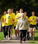 12 October 2010; Ireland’s leading senior and junior runners are expected to compete in the annual Aviva Gerry Farnan Cross Country Festival to be held adjacent to the Magazine Fort in the Phoenix Park on Sunday 17th October, 2010. Kathleen Quigley, from Portobello, takes a stroll along the canal as Club President and Race Director Eamonn Coghlan, second from left, and members of the Aviva Running Club, from left, Jane Gleeson, Martin Kelly, Peter Vincent, Ruth Bowe, Alice O'Leary and Clodagh Flynn get in some training ahead of the Aviva Gerry Farnan Cross Country race. Portobello, Dublin. Picture credit: Stephen McCarthy / SPORTSFILE